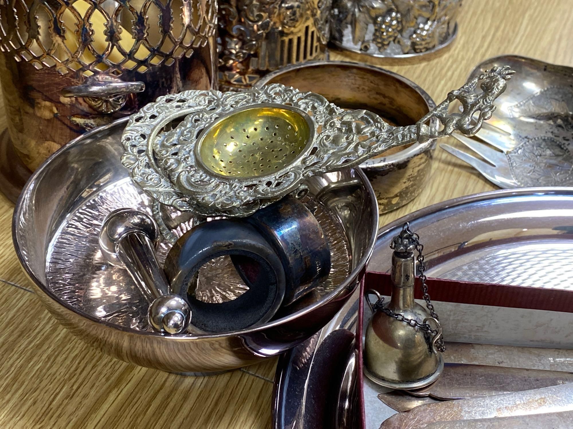 A quantity of plated items including coasters, flatware, cream jug, etc.